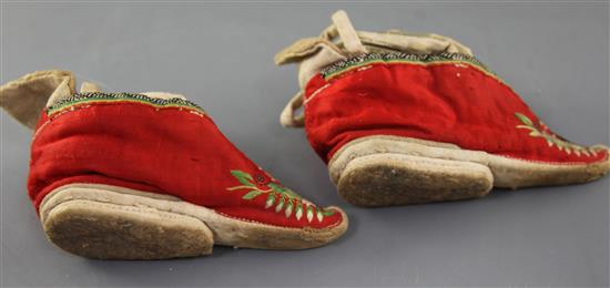 Four pairs of Chinese embroidered silk ladys shoes, late Qing dynasty